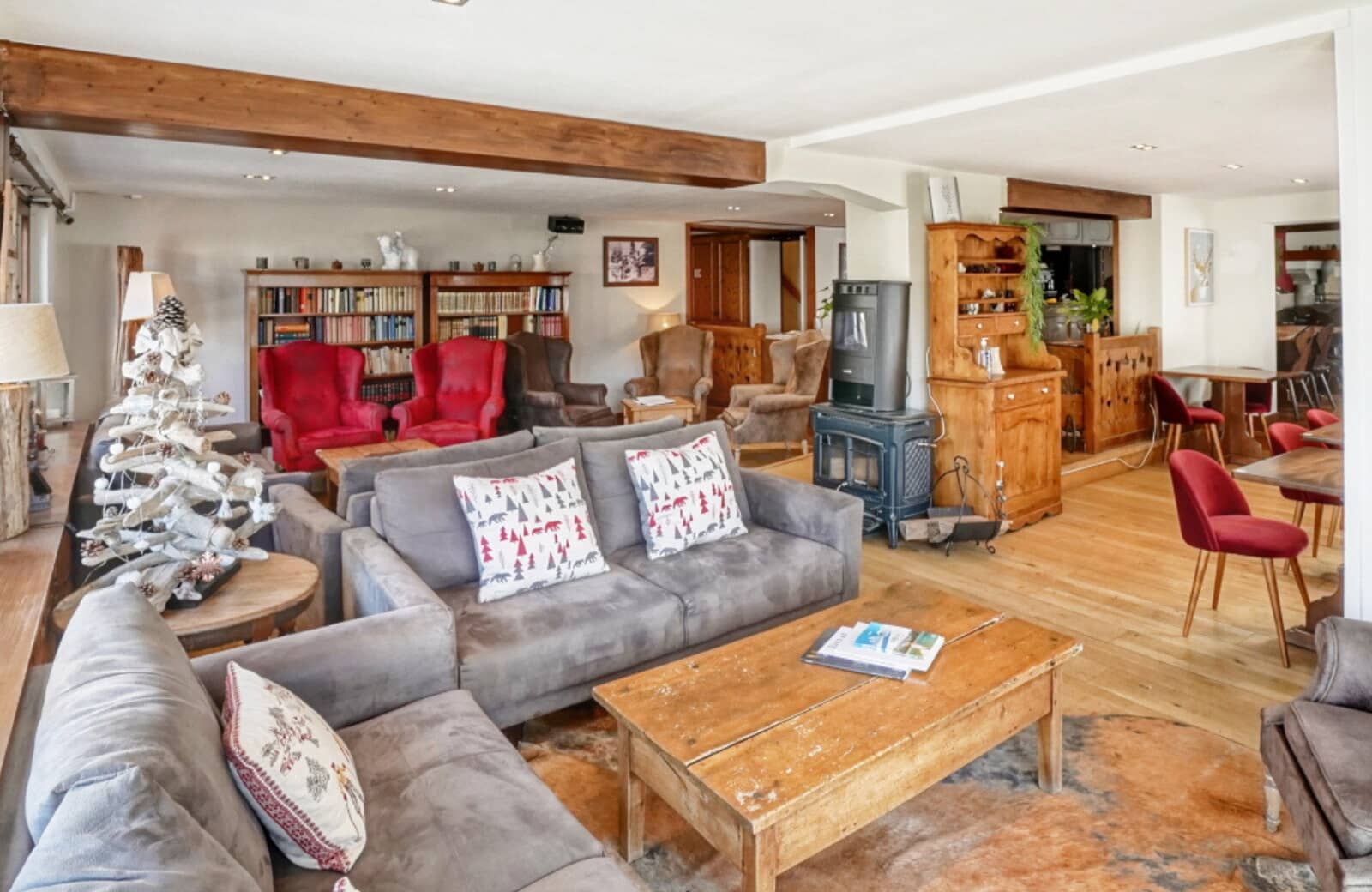 Lounge with wood-burning stove, library area, and seating for 15