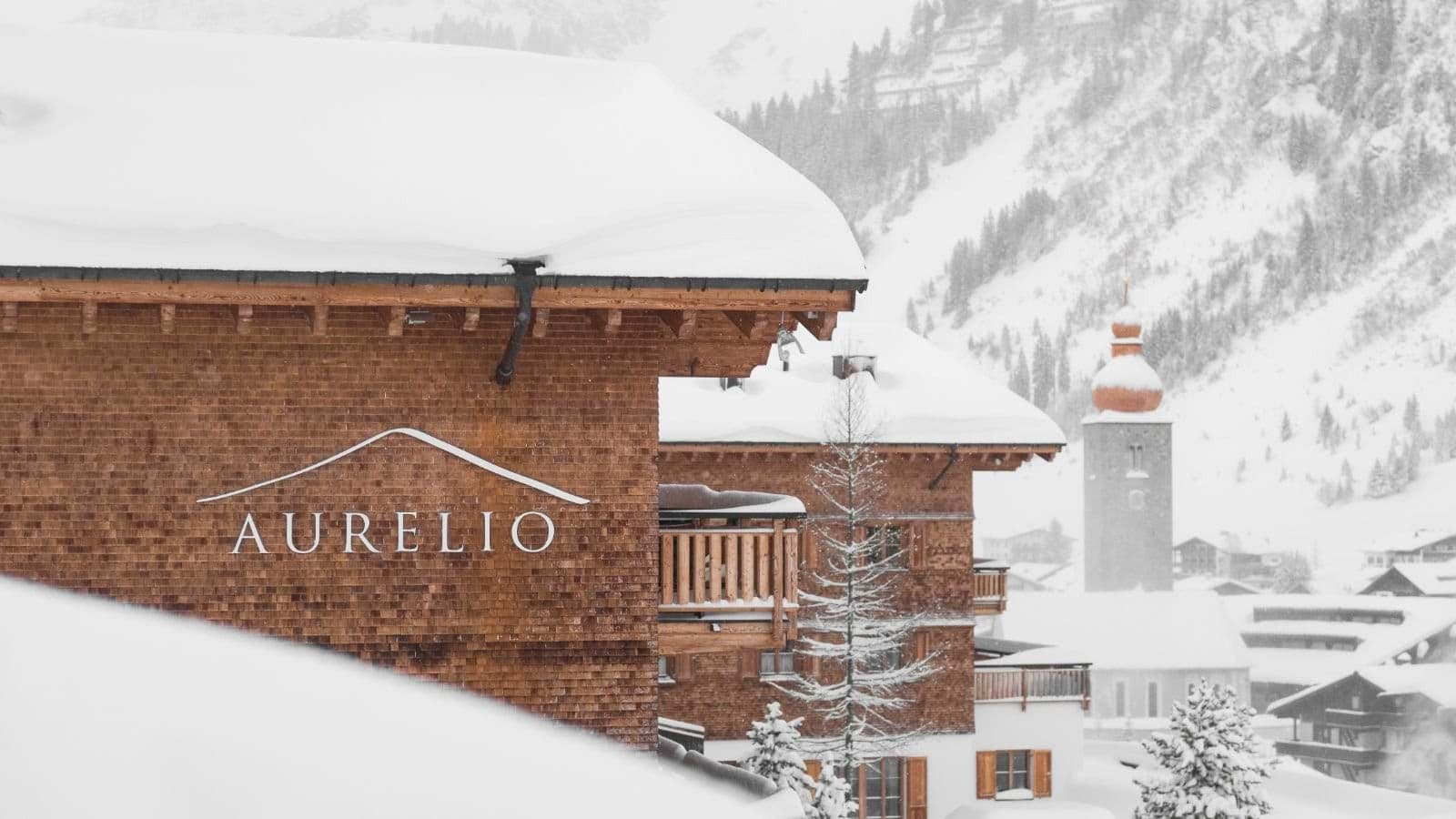 Slopeside chalet exterior with views of the village and church tower