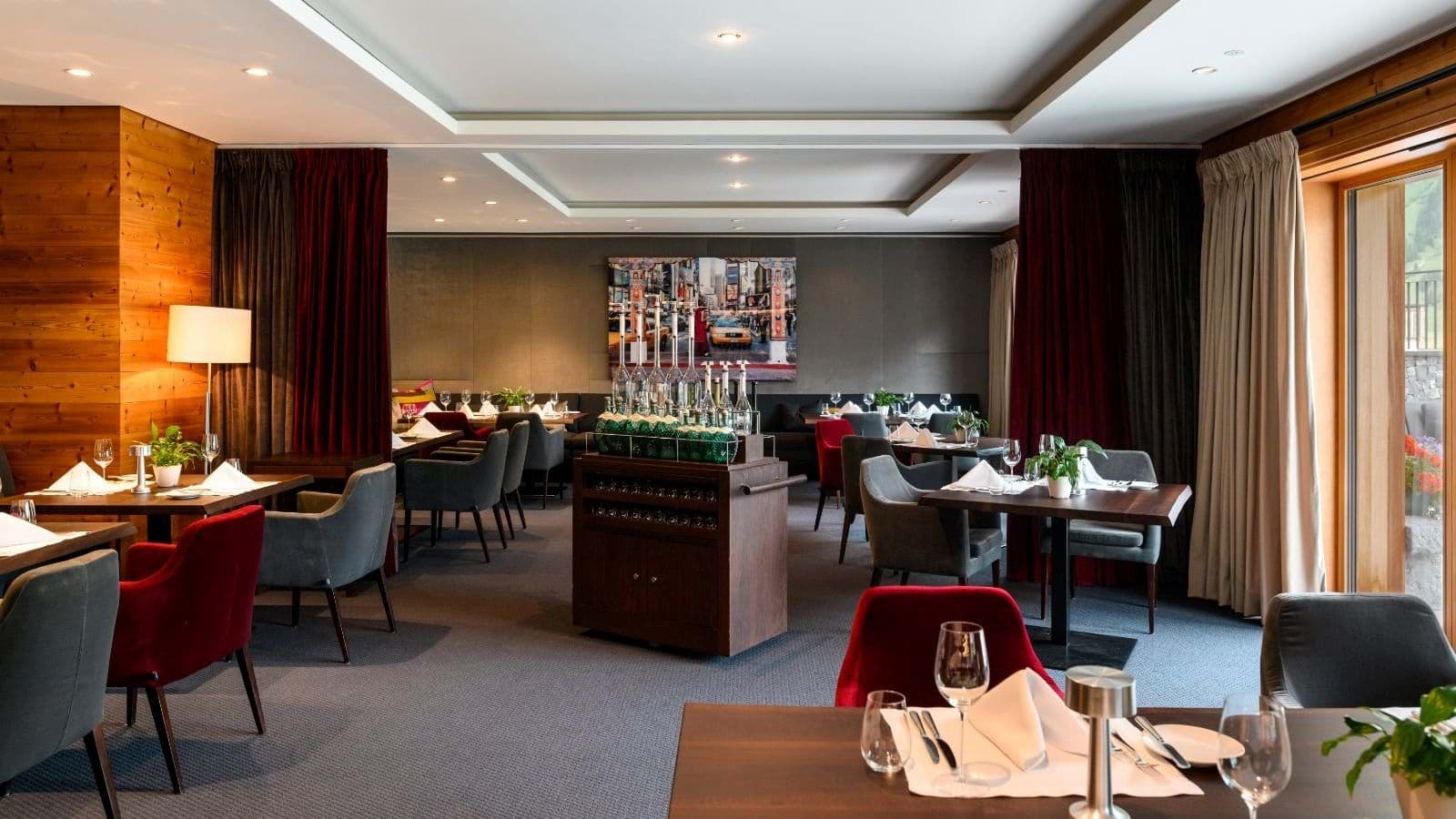 Dining area with restaurant-style seating and central wine service cart