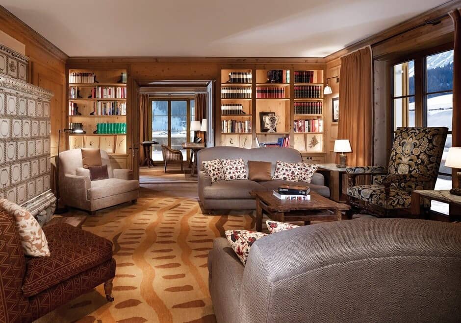 Library lounge with wood-burning masonry stove and built-in shelving