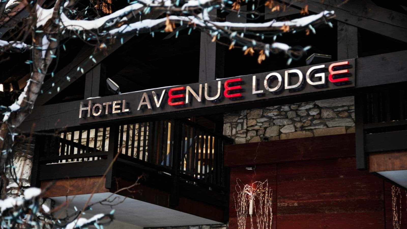 Hotel Avenue Lodge entrance with stone facade and timber framing
