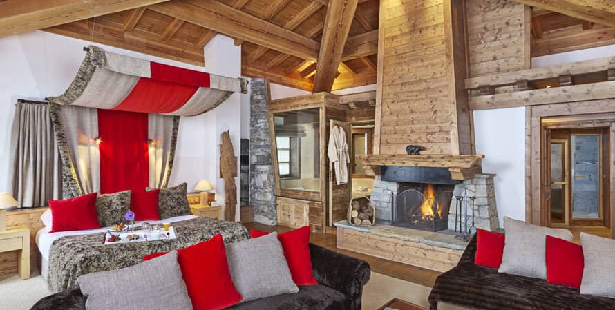 Primary suite with wood-burning fireplace and ensuite bath with soaking tub