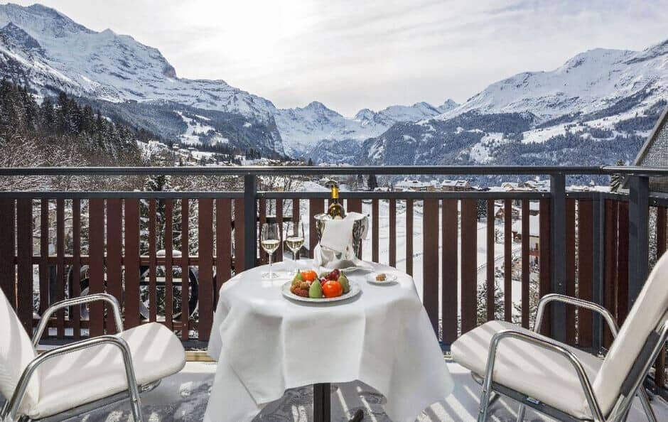 Private balcony with bistro seating for two and mountain views
