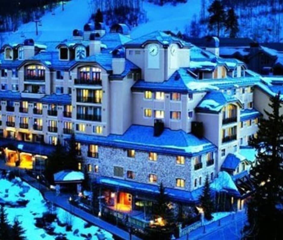Ski-in, ski-out resort exterior with lighted slopes in background