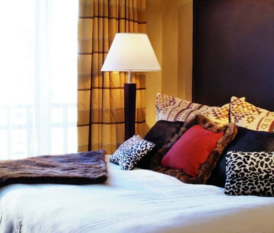 Guest bedroom with blackout curtains and floor-to-ceiling windows