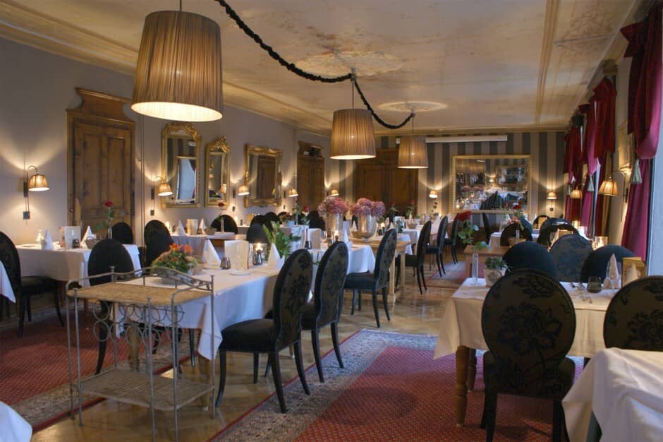 Formal dining room with seating for 30+ and original ceiling medallions
