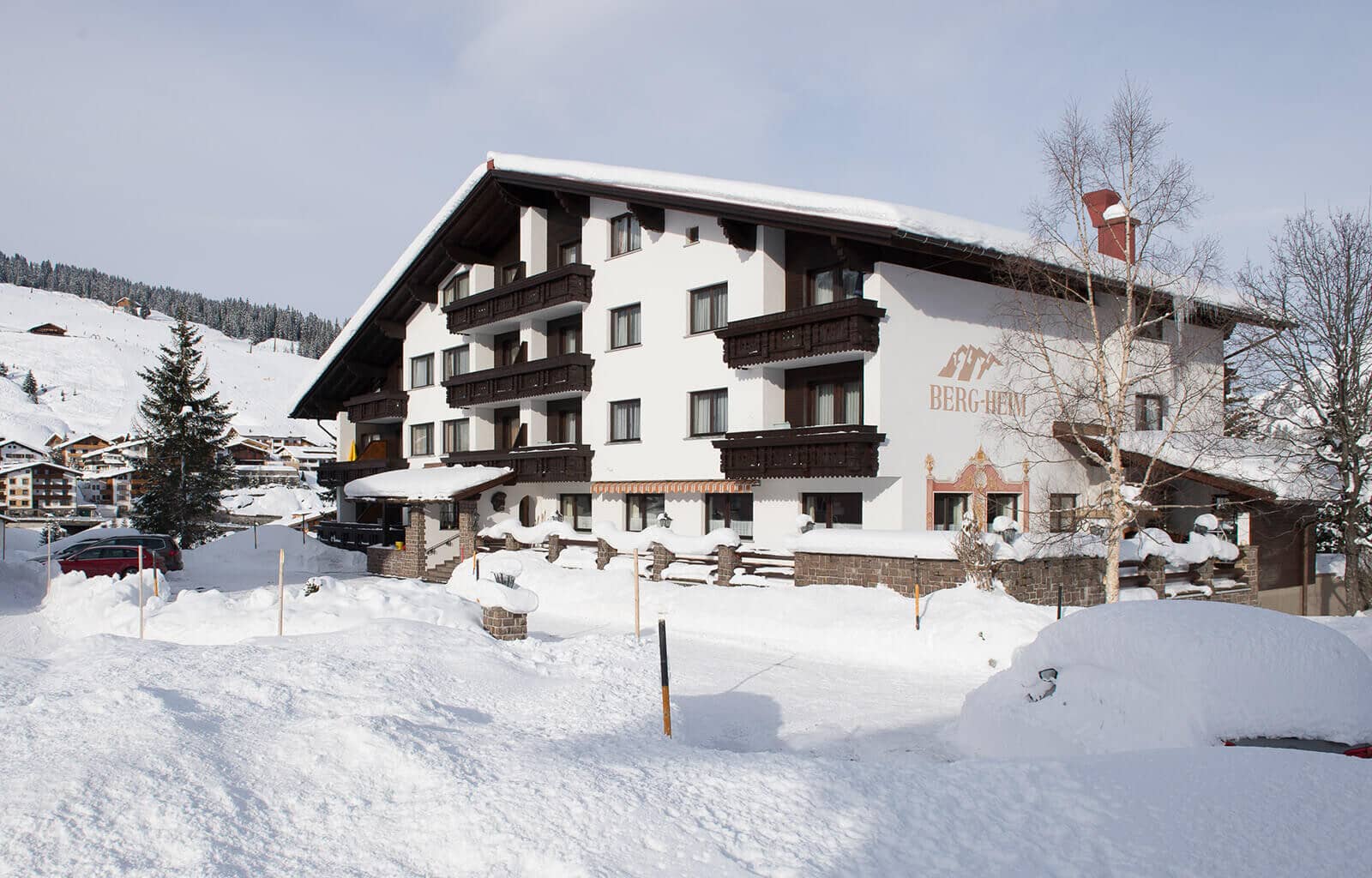Chalet exterior with private balconies and ski-in access