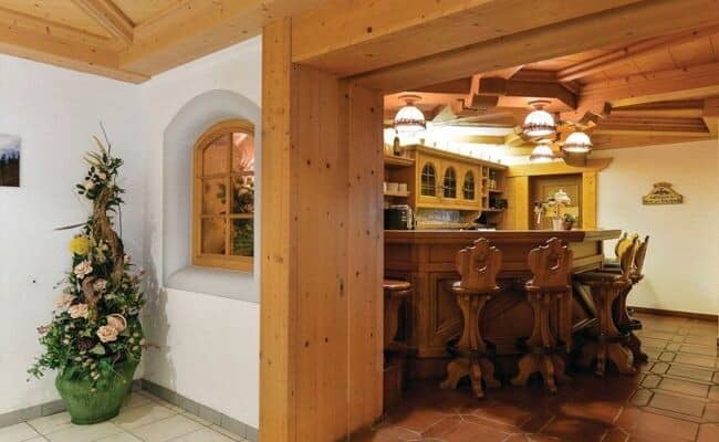 Private timber bar with counter seating for four and built-in shelving