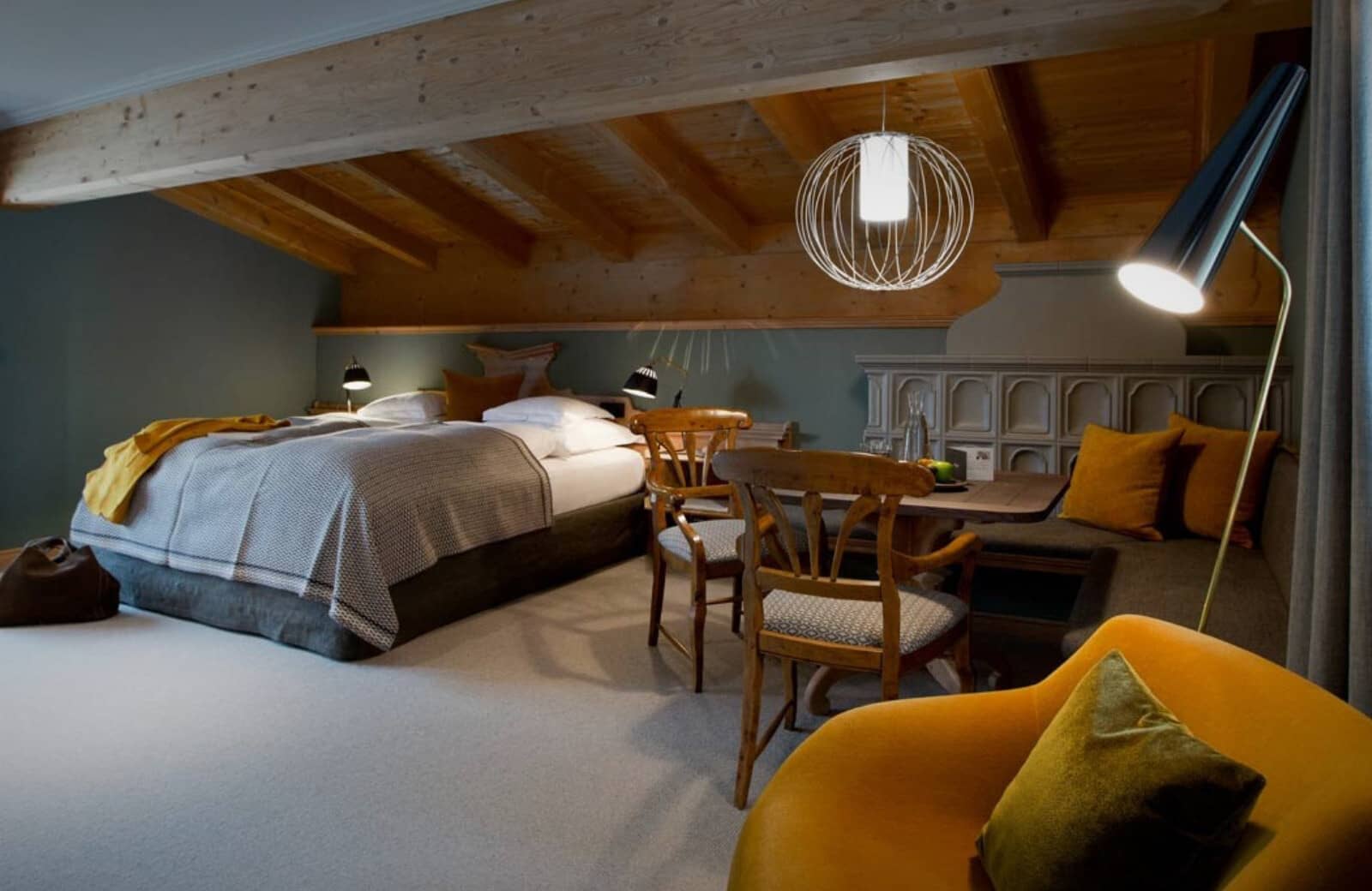 Attic bedroom with king bed and built-in dining nook