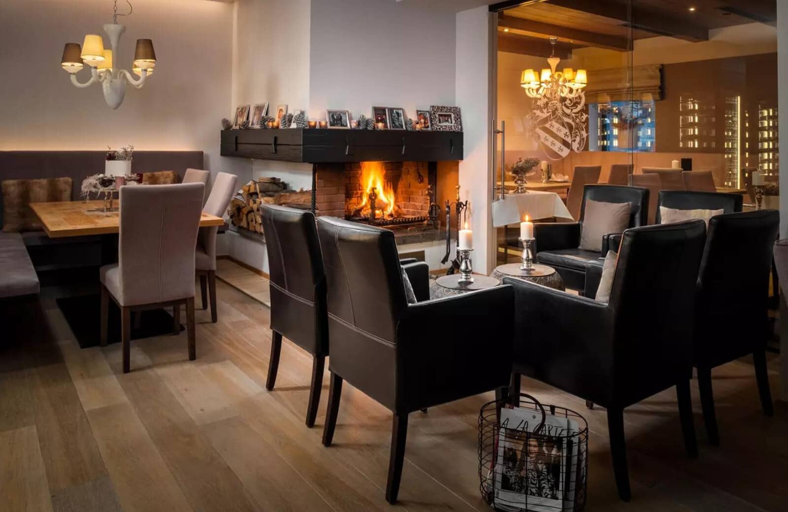 Living area with wood-burning fireplace and leather club chairs