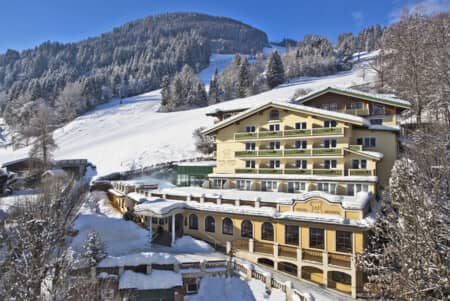 Ski-in/ski-out hotel exterior with direct access to groomed mountain runs