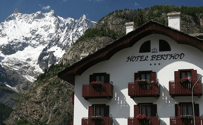 Hotel exterior with private flower-box balconies and Mont Blanc massif views