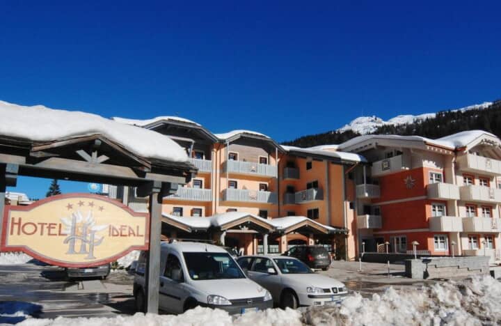 Hotel exterior with private balconies and on-site guest parking