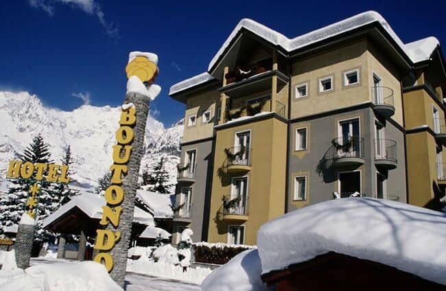 Hotel exterior with private balconies and mountain views