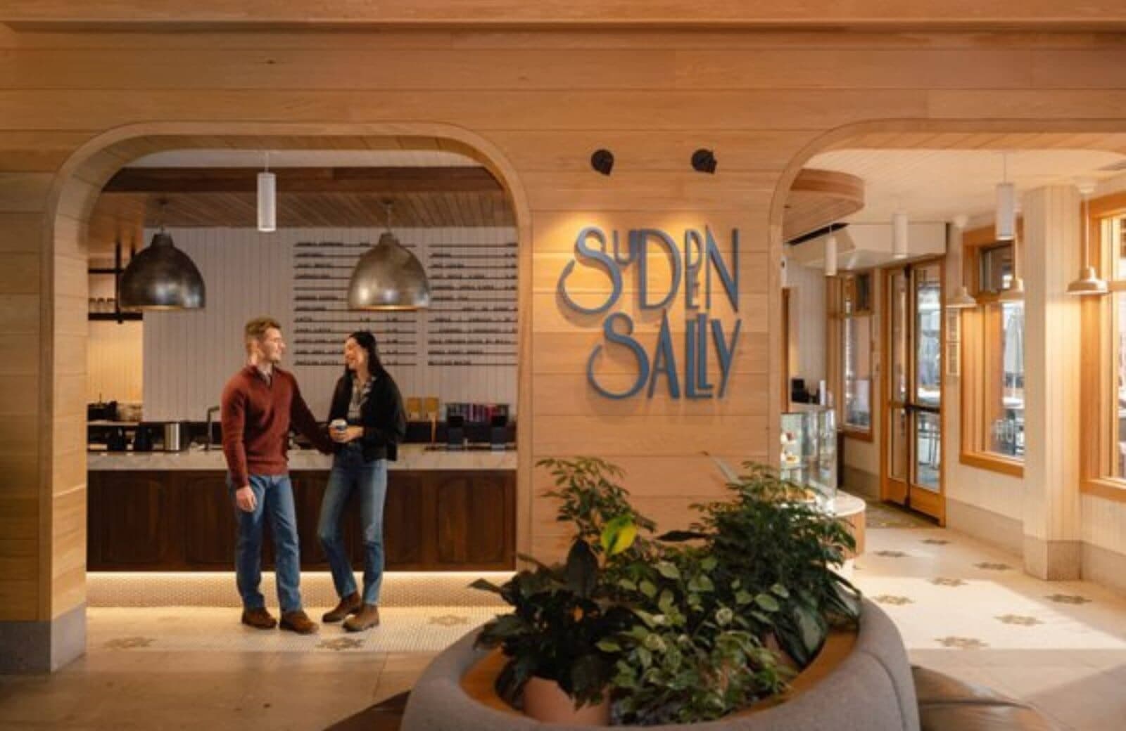 On-site cafe and coffee shop with wood-paneled service counter