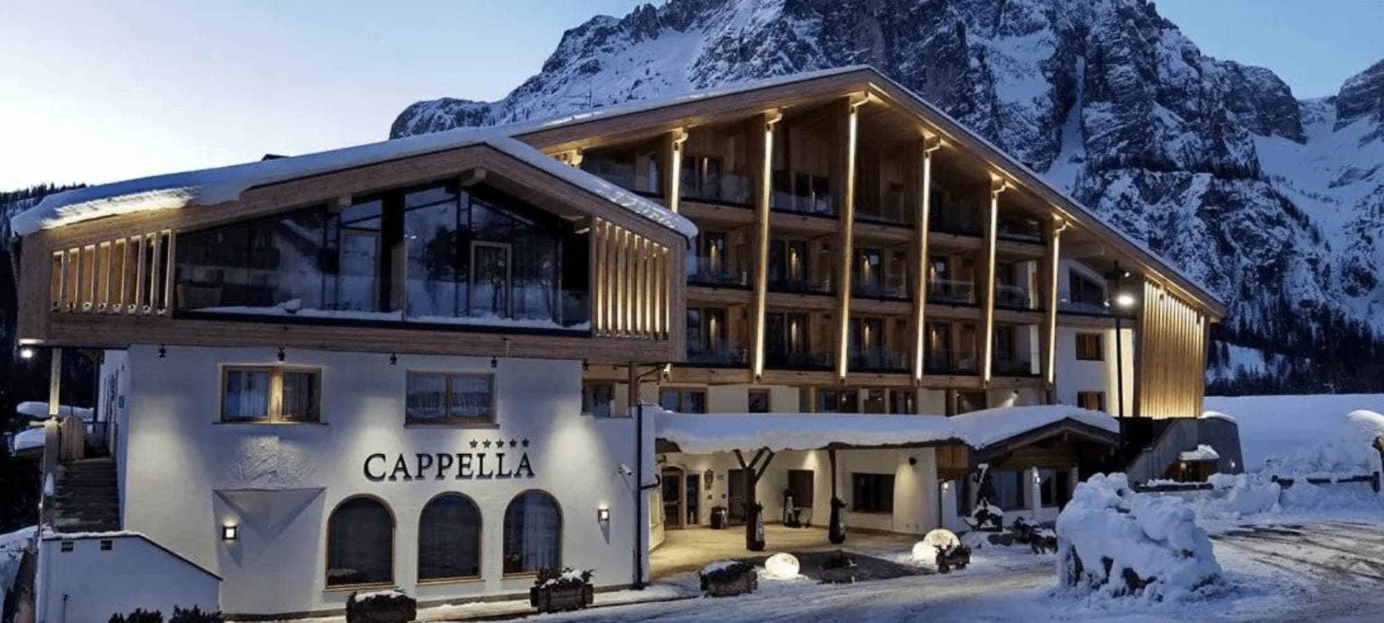 Ski-in/ski-out chalet with private balconies and mountain backdrop