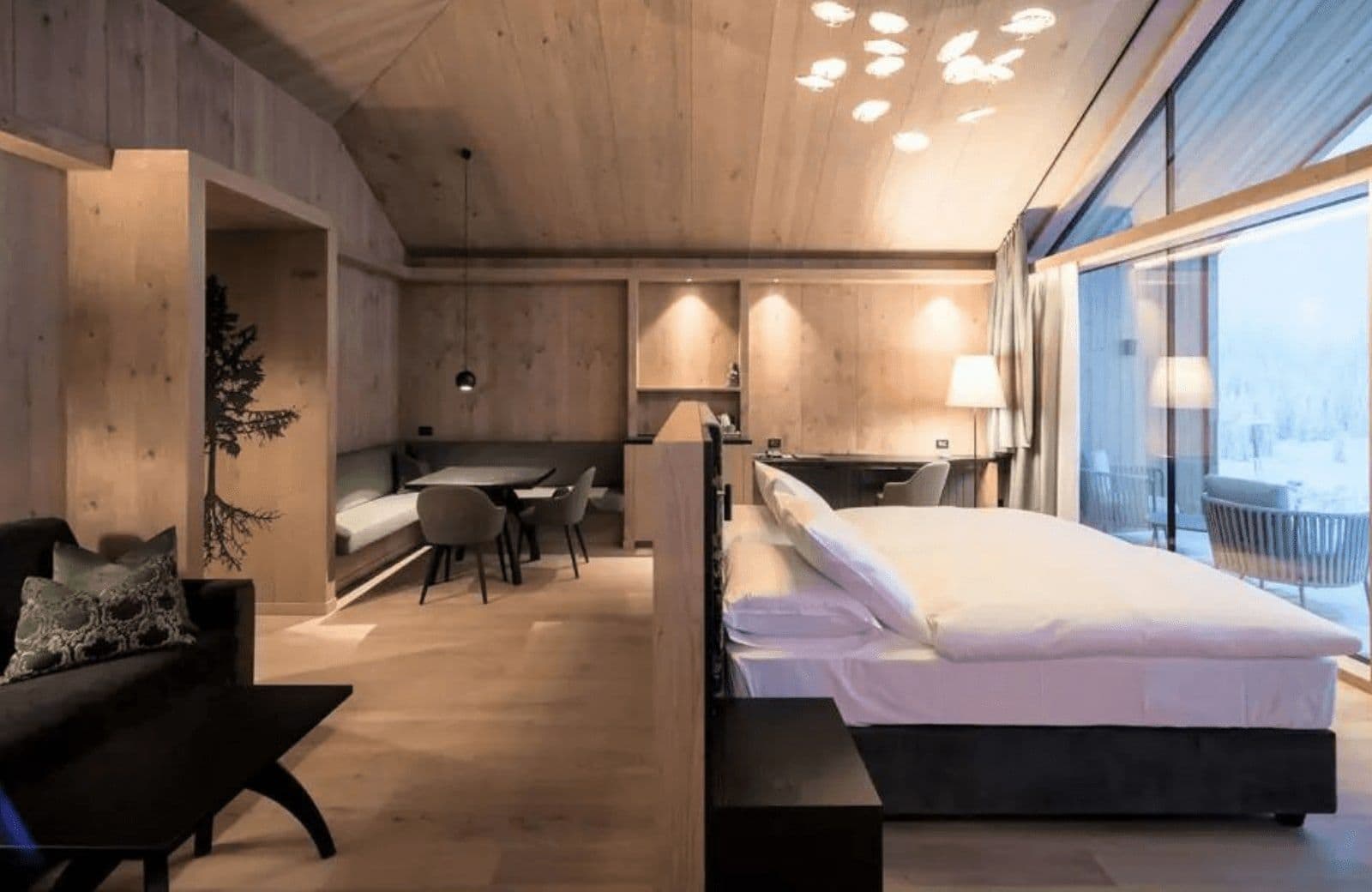 Studio suite with king bed, dining nook, and dedicated workspace