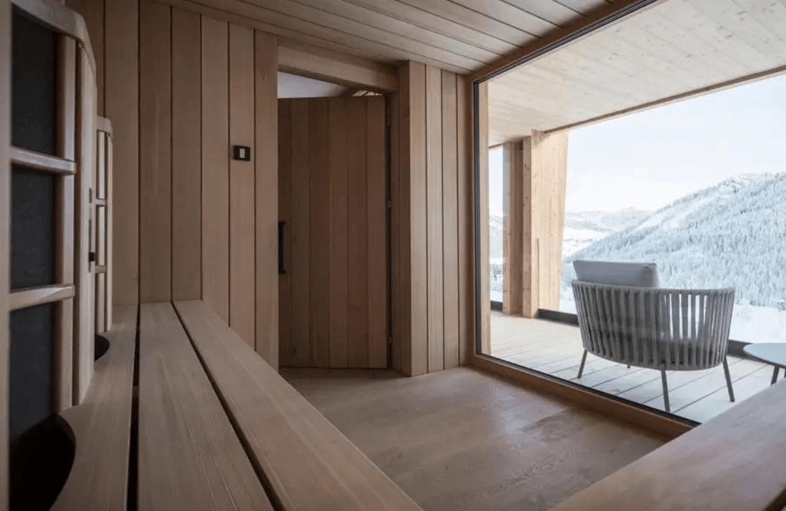 Private cedar sauna with floor-to-ceiling mountain views