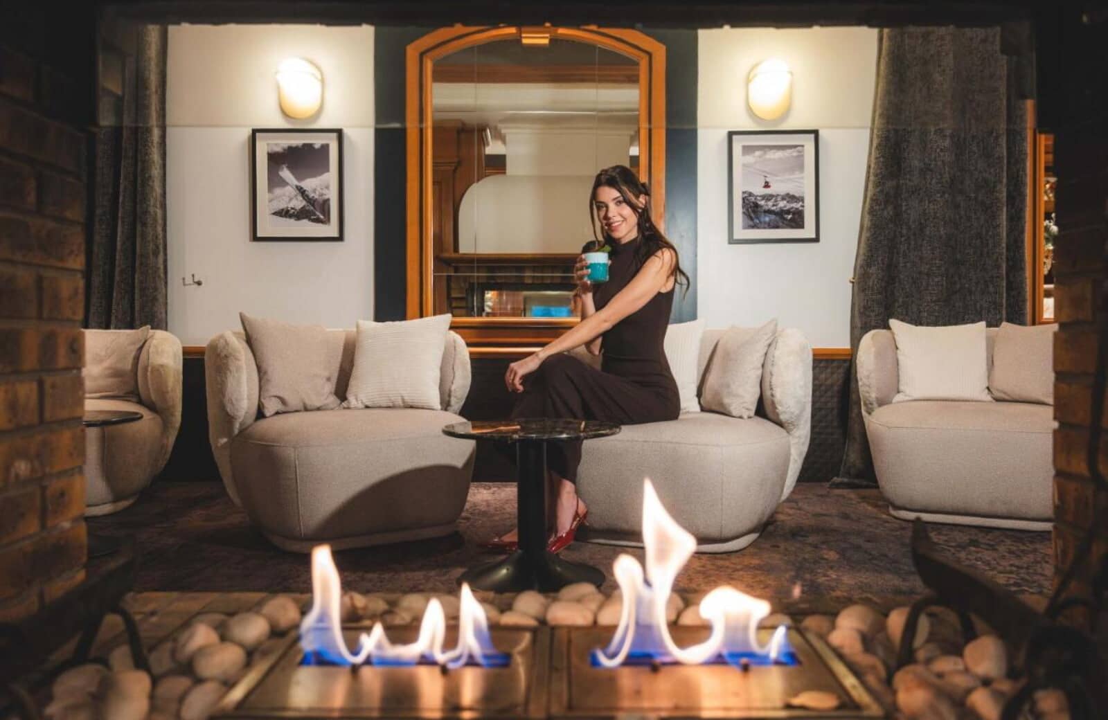 Lounge area with gas fireplace and plush swivel chair seating