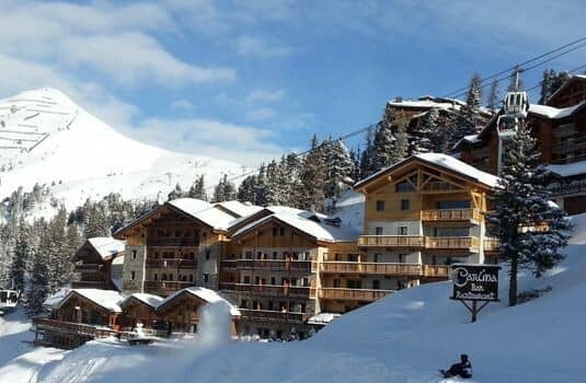 Chalet exterior with direct ski lift access and mountain views