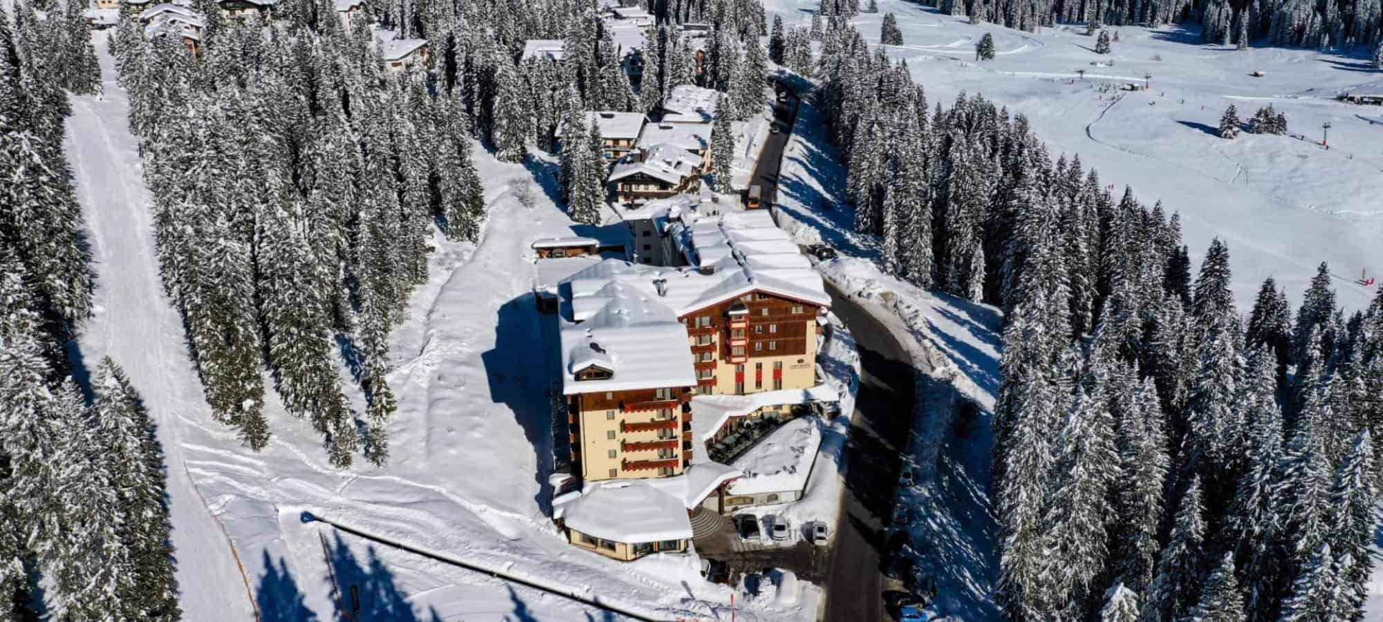 Aerial view of ski-in/ski-out chalet adjacent to groomed run