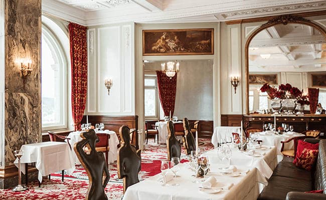 Formal dining room with marble pillars and original 19th-century architectural details