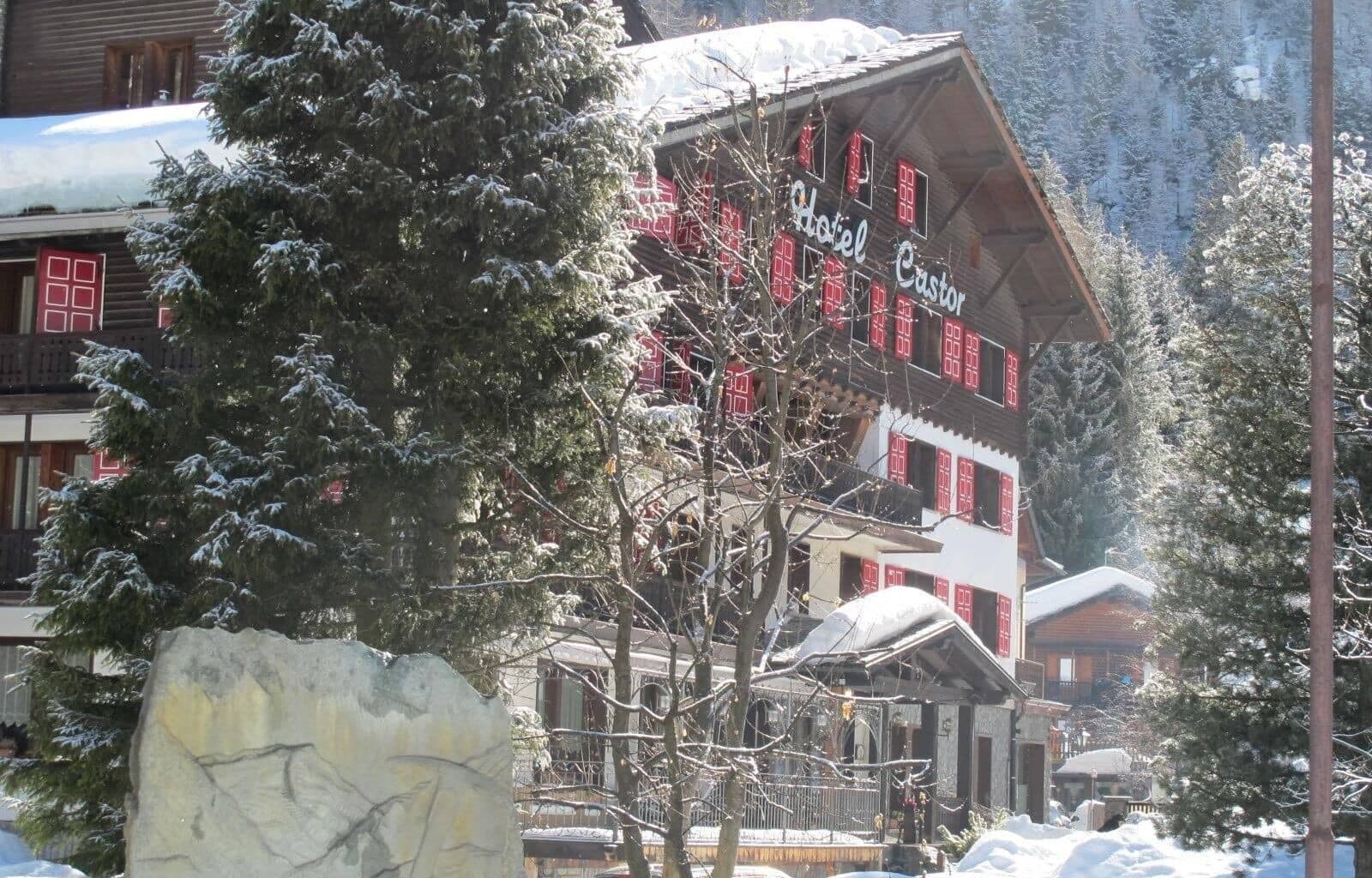 Chalet exterior featuring private balconies and traditional red shutters