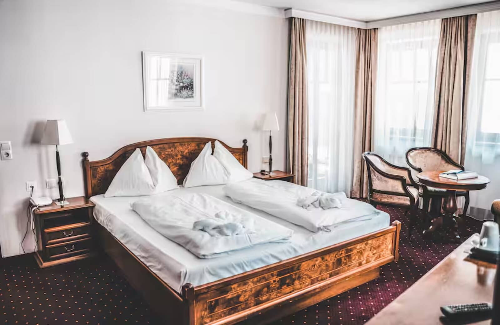 Bedroom with king bed and seating area for two