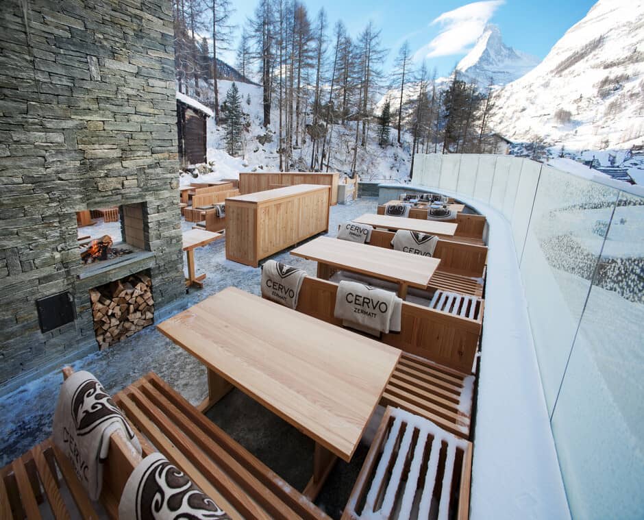 Outdoor terrace with wood-burning fireplace and views of the Matterhorn