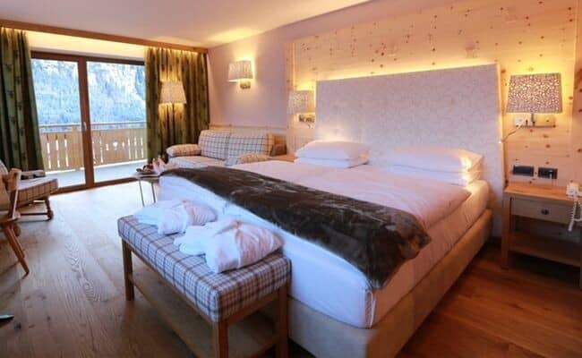 Primary bedroom with king bed and private balcony access