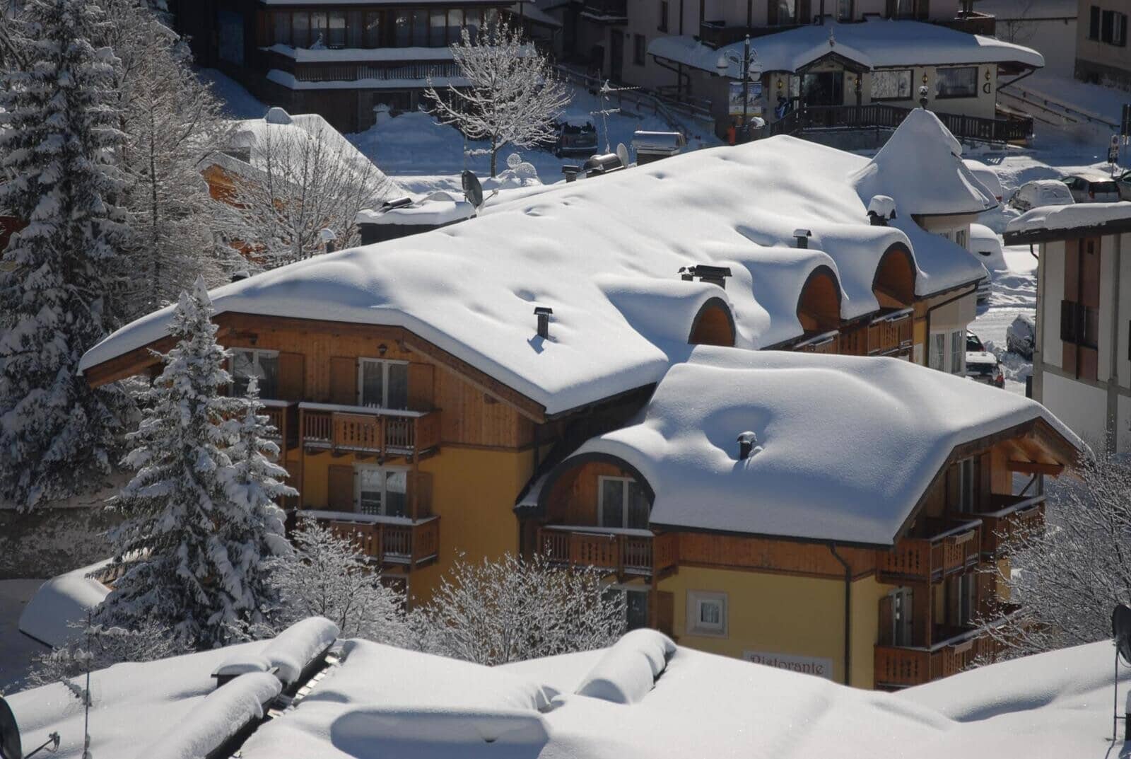 Chalet exterior with multiple private balconies and on-site restaurant