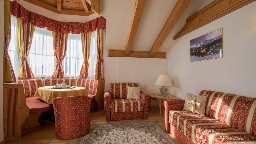 Seating area with breakfast nook and vaulted timber ceilings