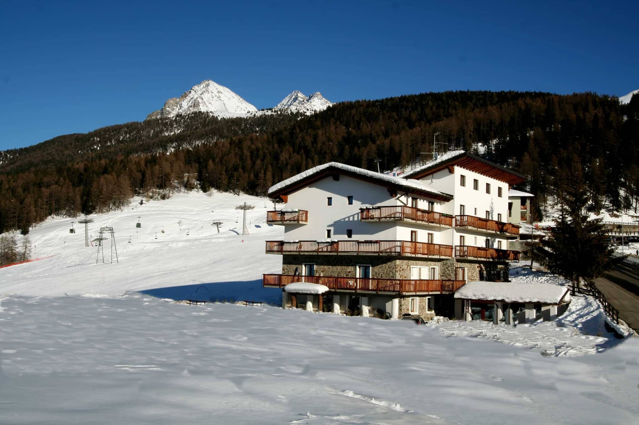 Ski-in/ski-out chalet with wrap-around balconies adjacent to mountain lifts