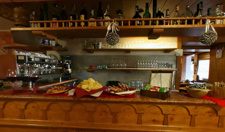 Private bar with professional espresso machine and liquor selection