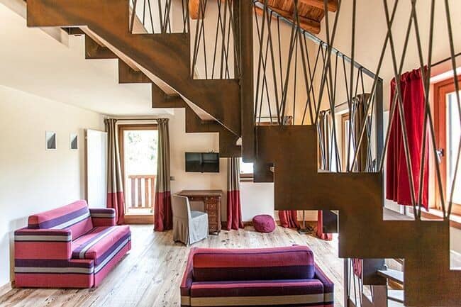 Living area with industrial metal staircase and workstation