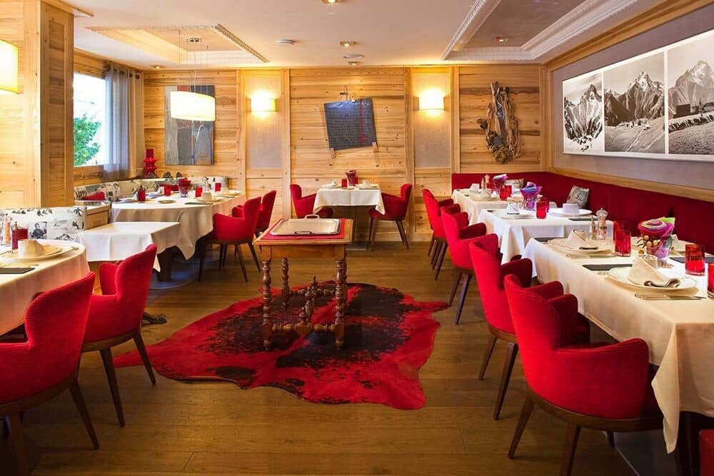 Dining room with wood paneling and banquet seating for large groups