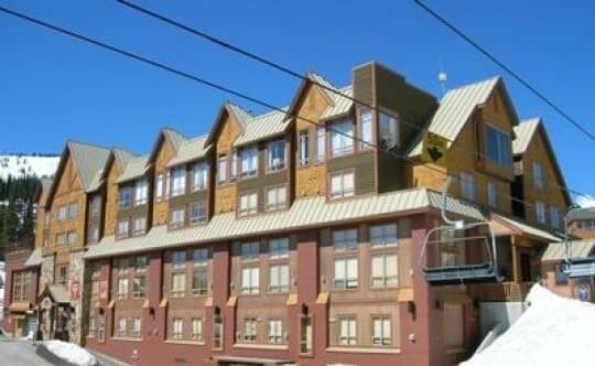 Ski-in, ski-out lodge exterior with direct access to chairlift