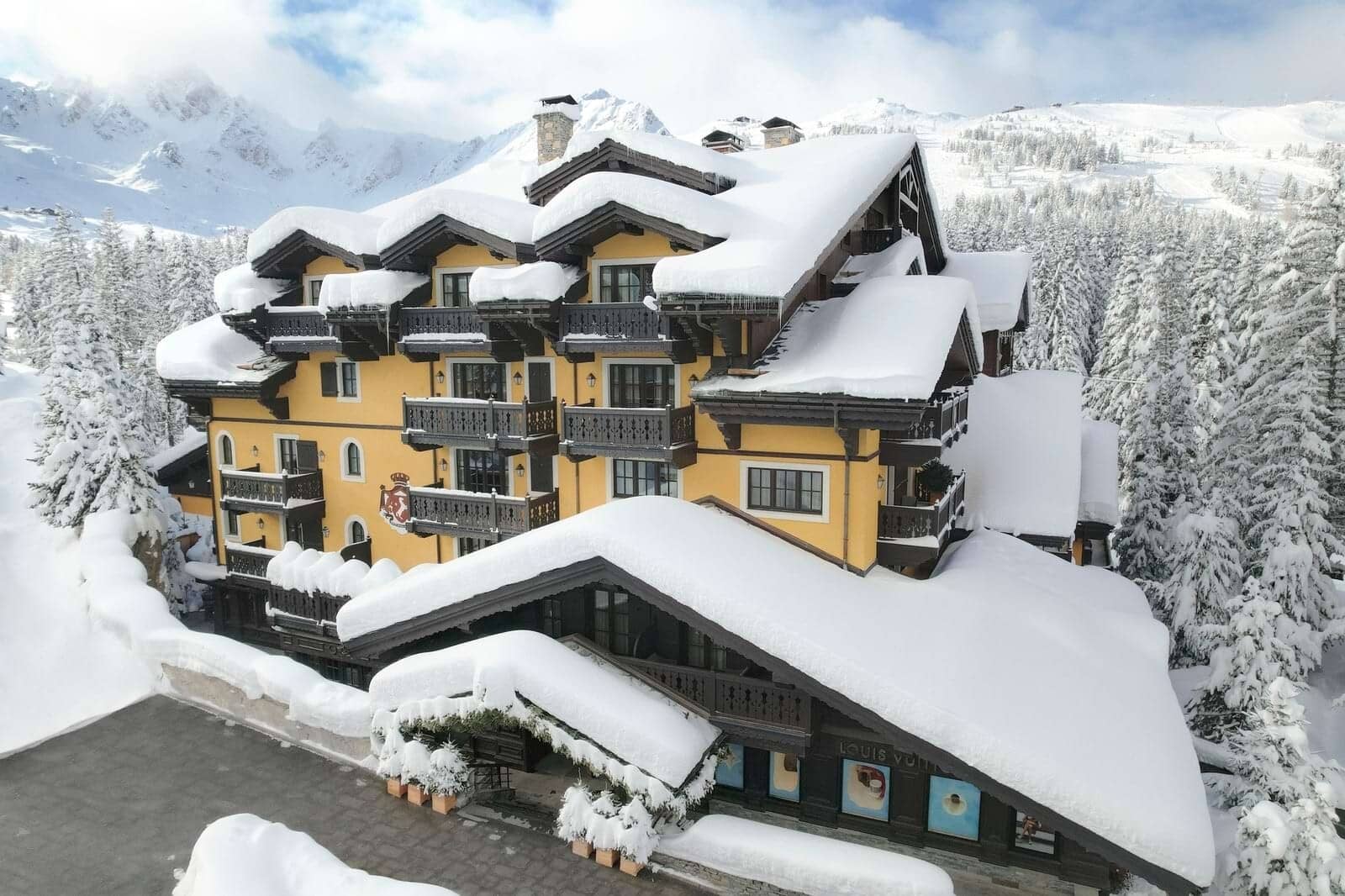 Ski-in, ski-out chalet exterior with private balconies and mountain views