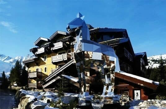 Ski-in, ski-out chalet exterior with private balconies and mountain views
