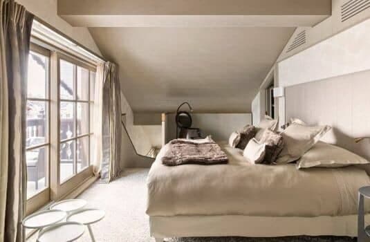 Loft bedroom with king bed and private balcony access