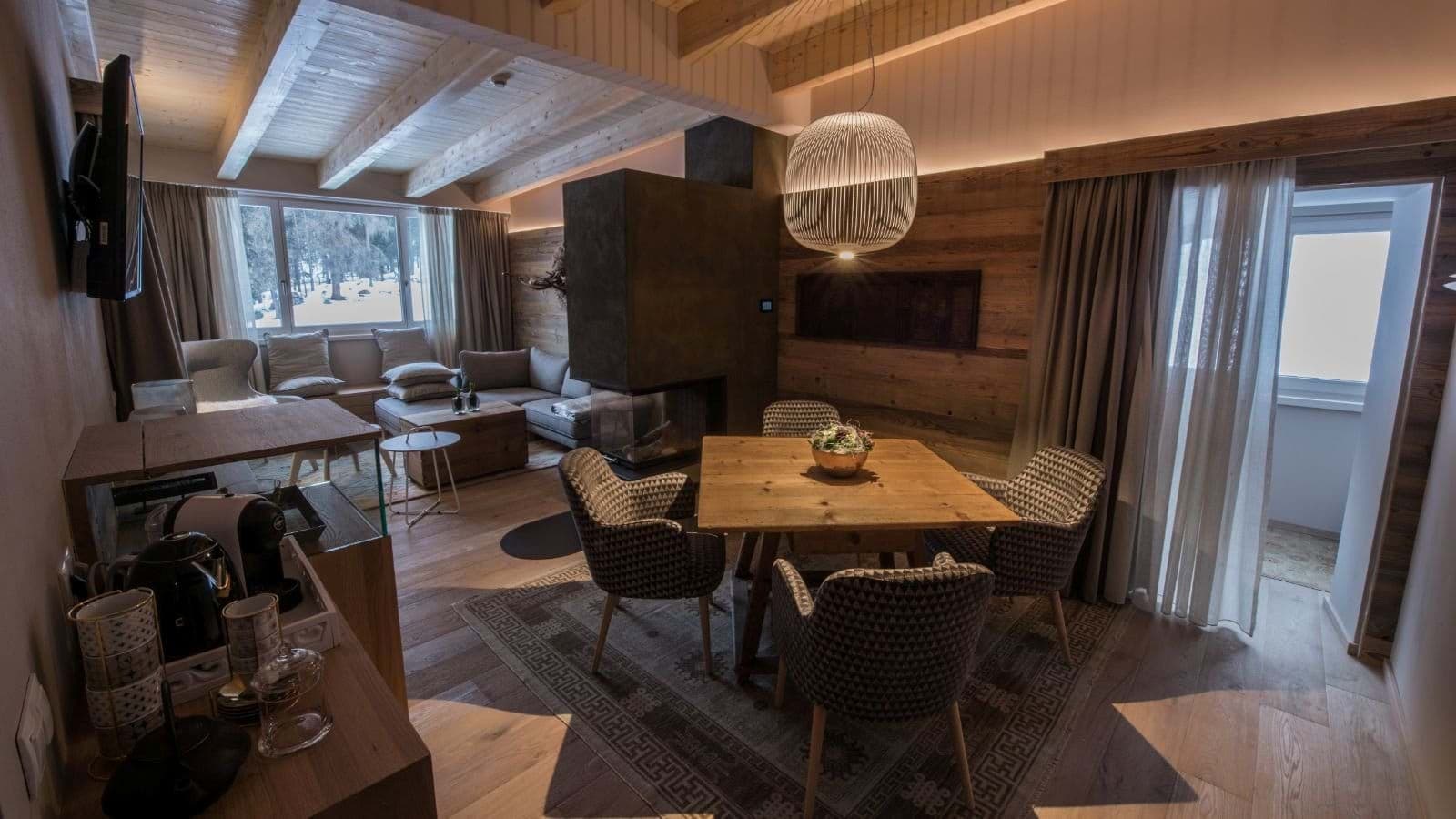 Open living area with wood-burning fireplace and dining for 4