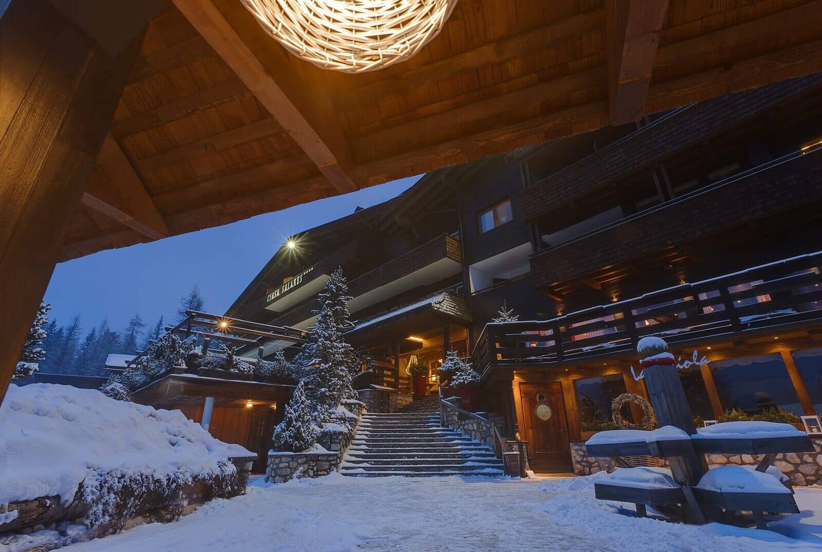 Chalet entrance with heated stone stairs and multiple private balconies