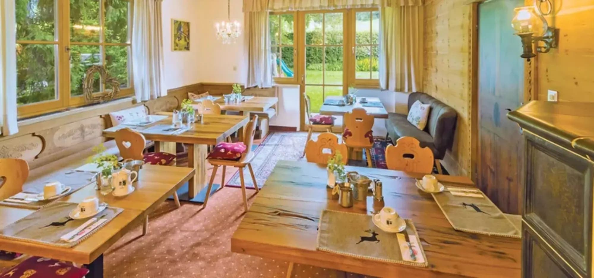 Dining area with booth seating and direct garden access