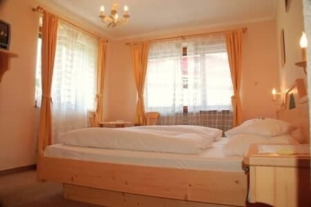Guest bedroom with double bed and blackout curtains