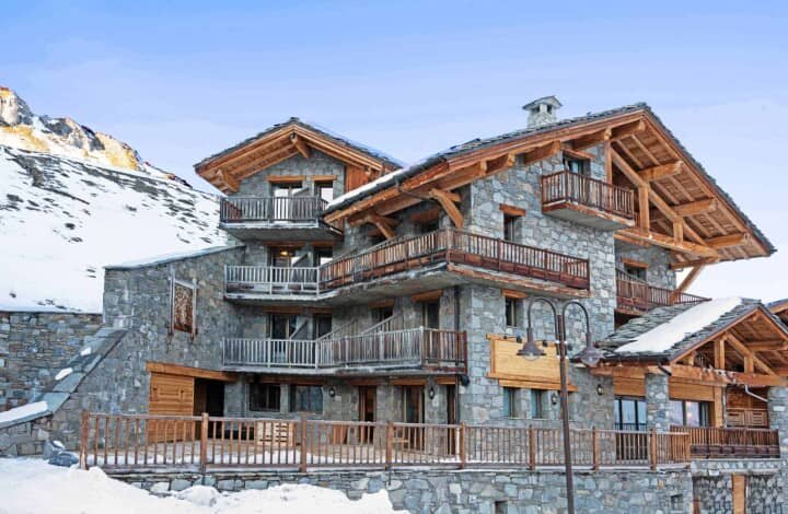 Stone and timber chalet with multiple private balconies and mountain views