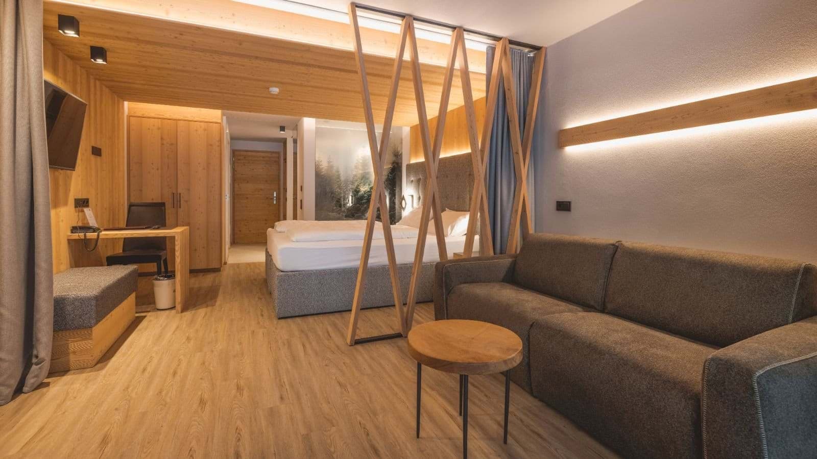 Studio suite with king bed, sofa, and dedicated workspace