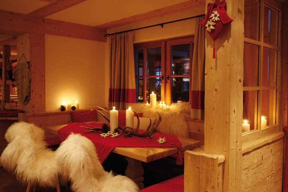 Dining nook with built-in bench seating and timber beam accents