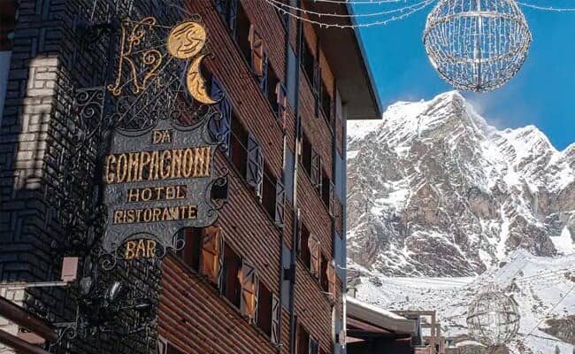 Hotel exterior with restaurant and bar; walking distance to ski runs