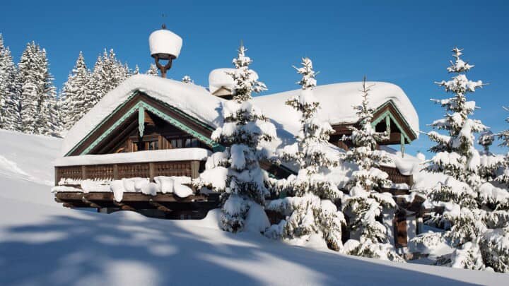 Ski-in, ski-out timber chalet with traditional carved eaves and private balconies