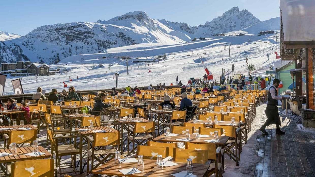 Ski-in/ski-out terrace dining with mountain views and table service